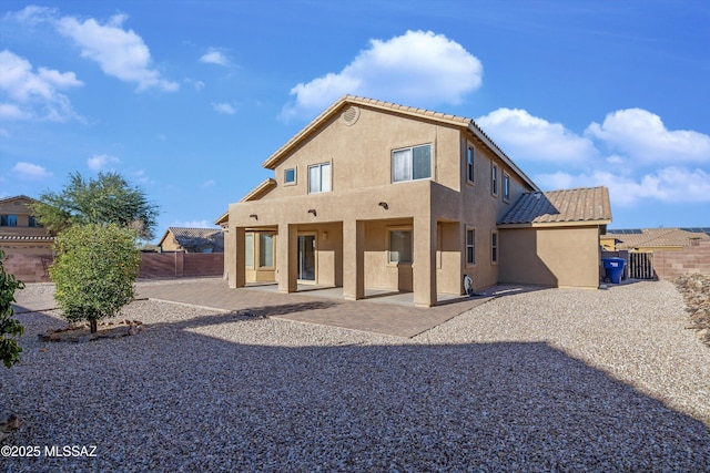 back of property featuring a patio area