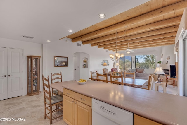 kitchen featuring light brown cabinetry, decorative light fixtures, beamed ceiling, dishwasher, and wood ceiling