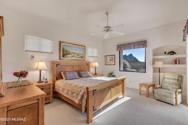 bedroom featuring light colored carpet and ceiling fan