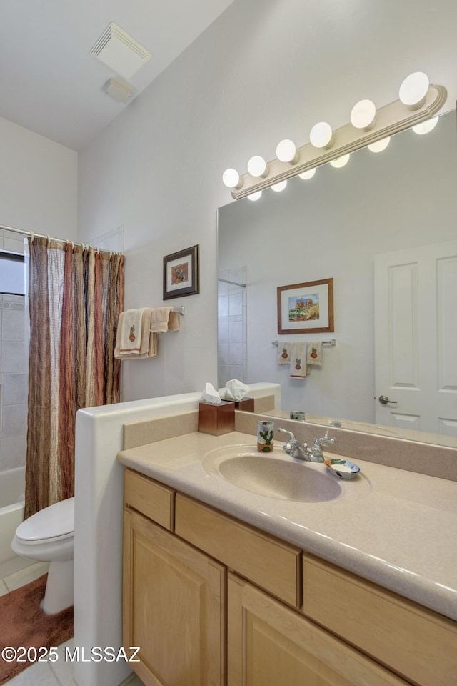 full bathroom featuring toilet, vanity, tile patterned floors, and shower / bath combo with shower curtain