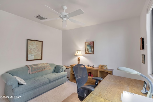 carpeted office with ceiling fan