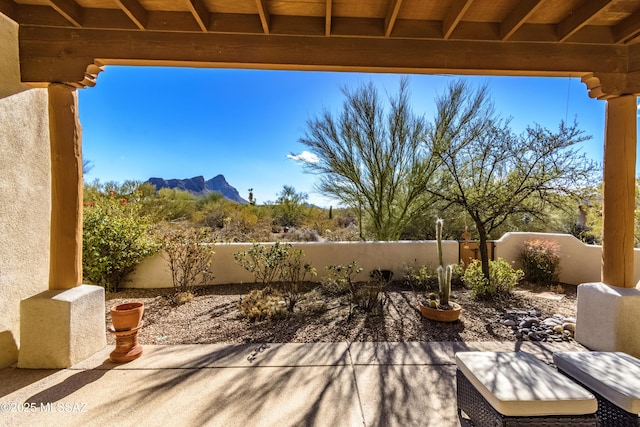 view of patio / terrace featuring a mountain view