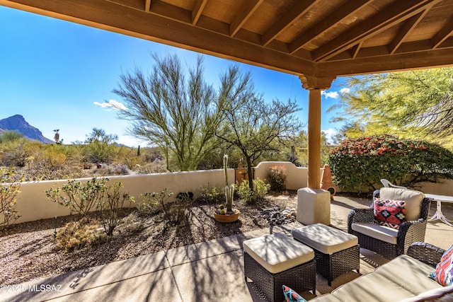 view of patio / terrace featuring a mountain view