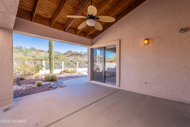 view of patio / terrace with ceiling fan and a mountain view