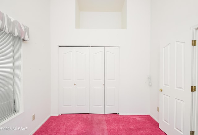 unfurnished bedroom with a closet and carpet