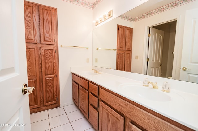 bathroom featuring vanity, toilet, and tile patterned flooring