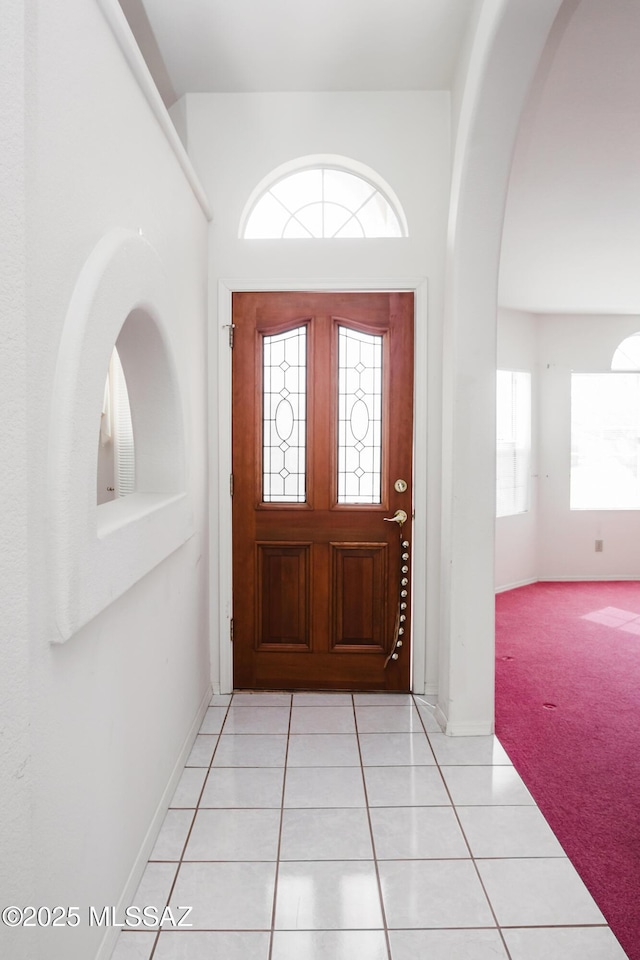 view of carpeted foyer