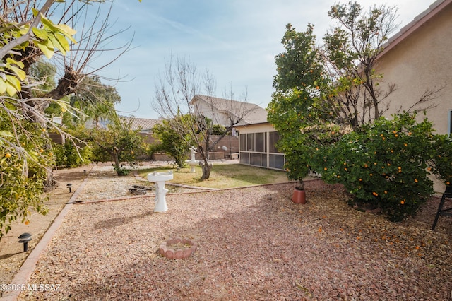 view of yard featuring a sunroom