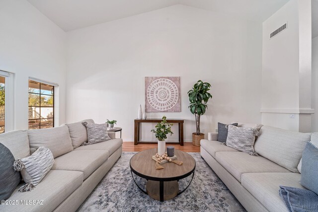 unfurnished living room featuring built in features, tile patterned flooring, sink, and a tile fireplace