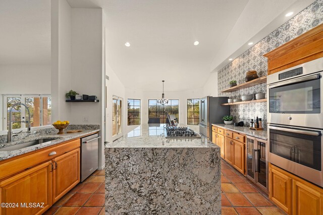 unfurnished dining area featuring high vaulted ceiling, a notable chandelier, and light hardwood / wood-style floors