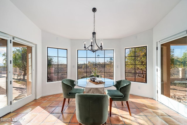 sunroom with a wealth of natural light and a chandelier