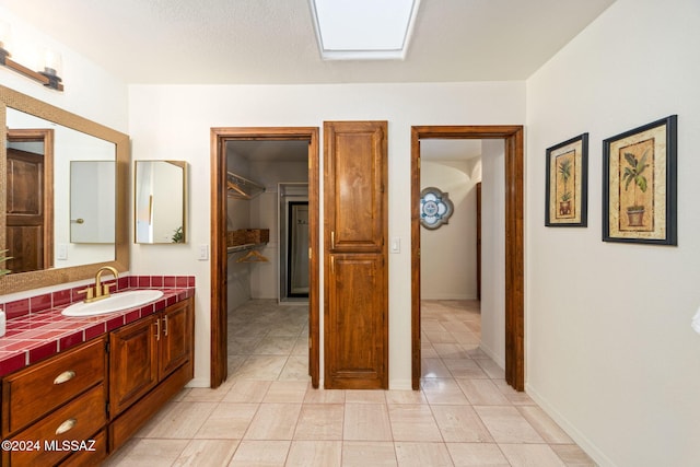 bathroom featuring vanity and baseboards