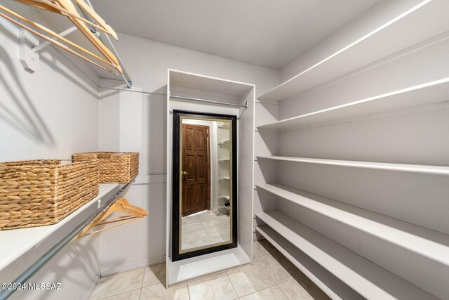 bathroom with tile patterned floors, vanity, and toilet