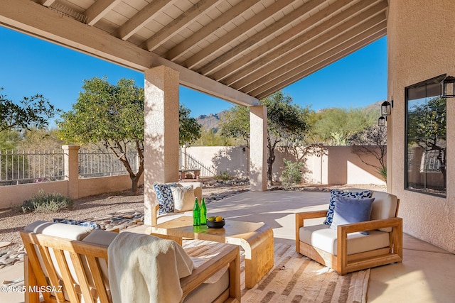 view of patio featuring an outdoor living space and a fenced backyard