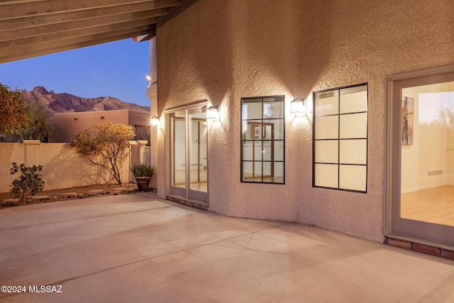 patio terrace at dusk with a mountain view