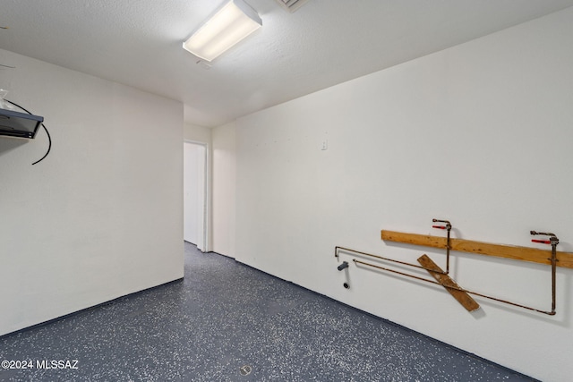 empty room with a textured ceiling