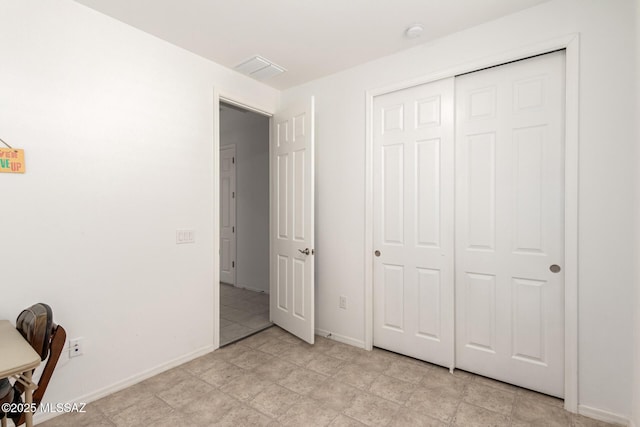 unfurnished bedroom with a closet