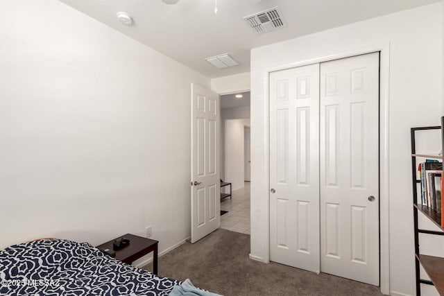 carpeted bedroom featuring a closet