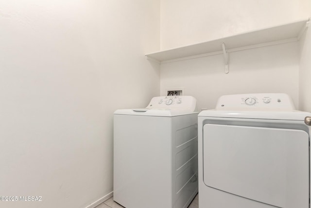 clothes washing area with washer and dryer