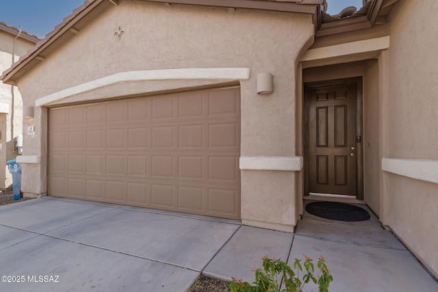 property entrance with a garage