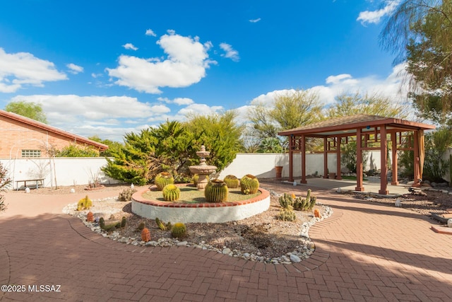 view of patio featuring a gazebo and fence