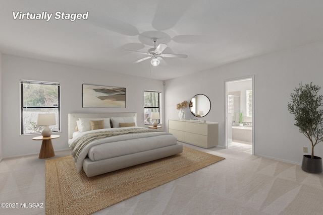 bedroom with ensuite bath, multiple windows, and light colored carpet