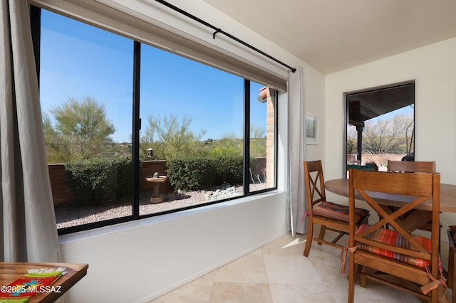 dining room featuring light tile patterned flooring