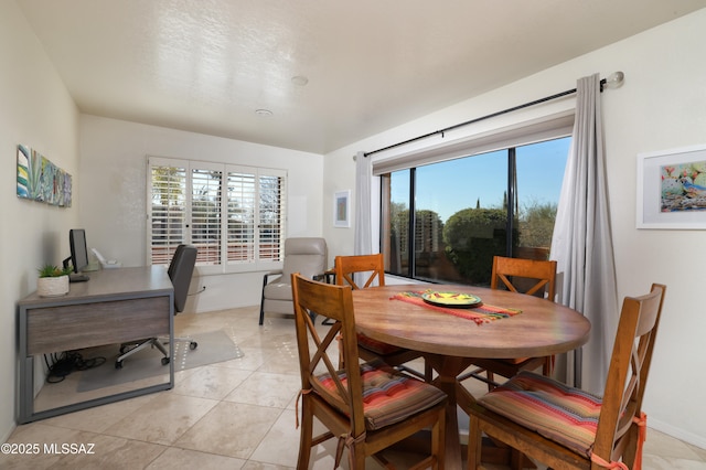 dining room featuring light tile patterned floors