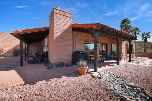 back of house featuring a patio area