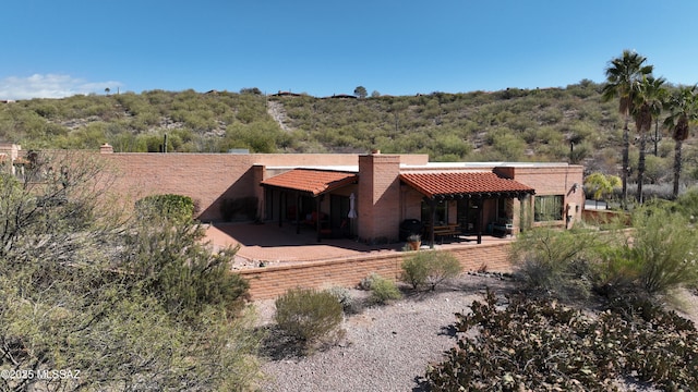 back of house with a patio area