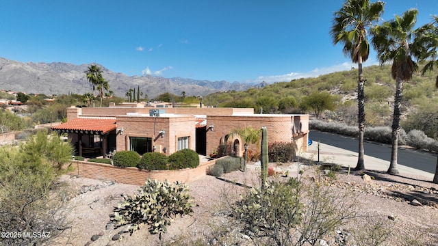 exterior space featuring a mountain view