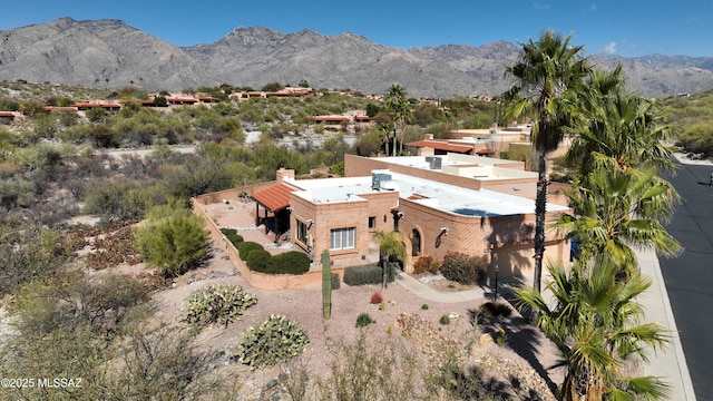 birds eye view of property featuring a mountain view