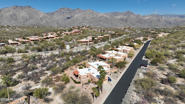 birds eye view of property with a mountain view