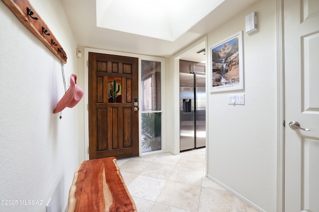 foyer with light tile patterned floors