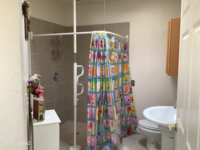 bathroom with tile patterned flooring, sink, curtained shower, and toilet