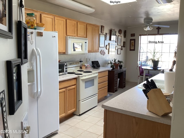 kitchen with tasteful backsplash, ceiling fan, light tile patterned floors, and white appliances