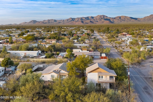 birds eye view of property with a mountain view