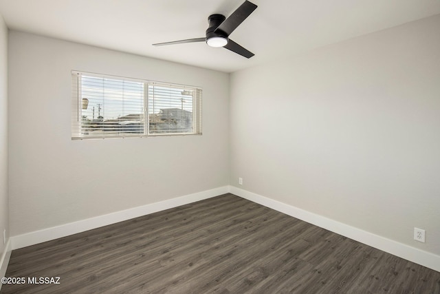 unfurnished room with ceiling fan and dark hardwood / wood-style flooring