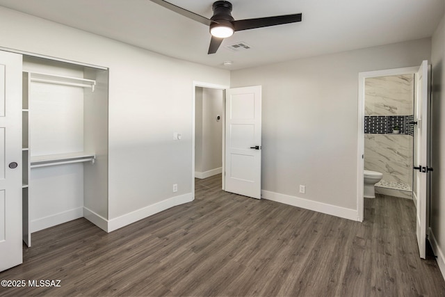 unfurnished bedroom featuring ceiling fan, dark hardwood / wood-style floors, and a closet