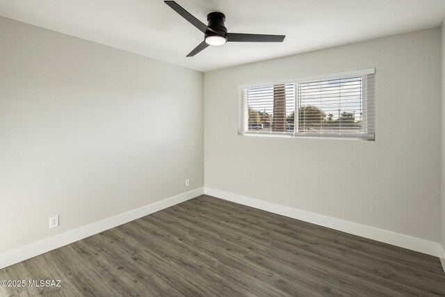 empty room featuring dark hardwood / wood-style floors and ceiling fan