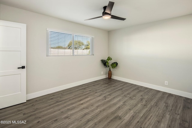 empty room with ceiling fan and dark hardwood / wood-style floors