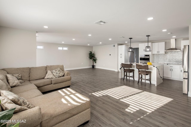 living room with dark hardwood / wood-style flooring