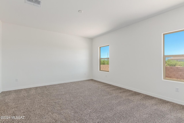 empty room with carpet flooring