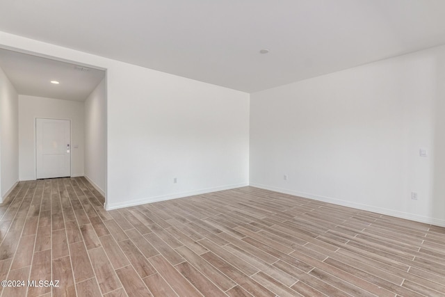 unfurnished room featuring light hardwood / wood-style flooring