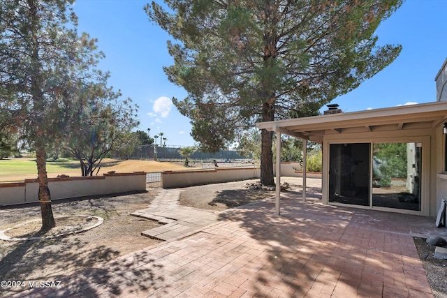 view of patio featuring fence