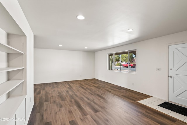 foyer entrance with recessed lighting and wood finished floors