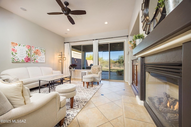 tiled living room with ceiling fan