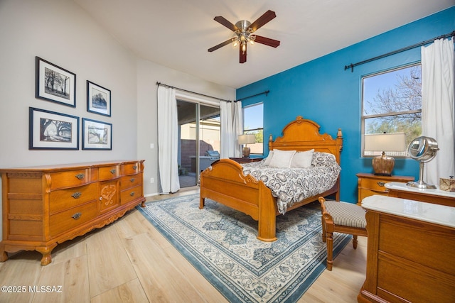 bedroom with access to outside, light hardwood / wood-style floors, and ceiling fan