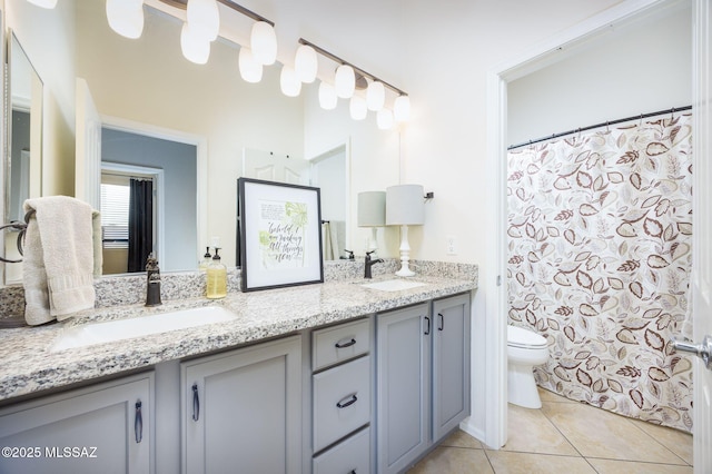 bathroom featuring a shower with curtain, vanity, tile patterned floors, and toilet