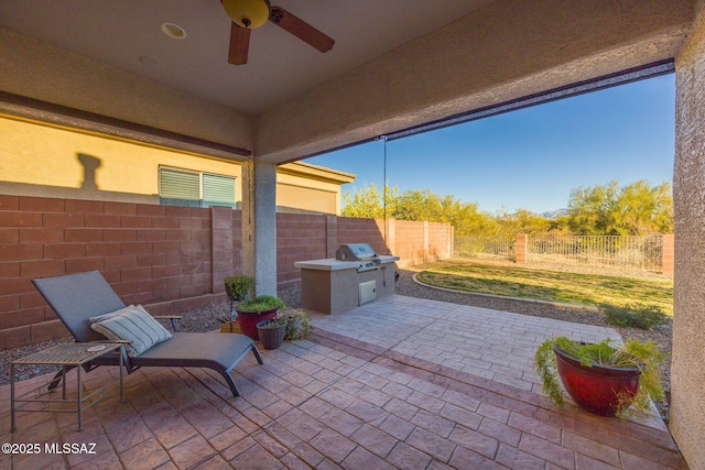 view of patio / terrace featuring a grill and ceiling fan